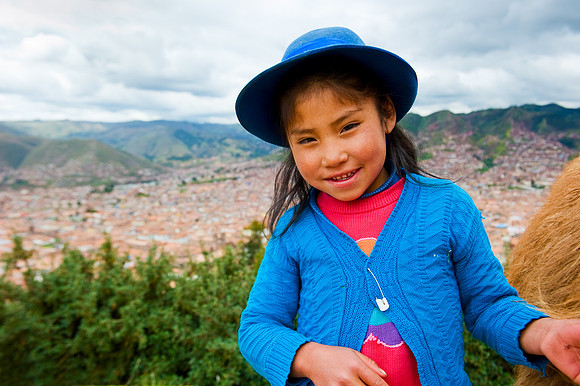 Cusco - Quechua Girl and View of Cusco