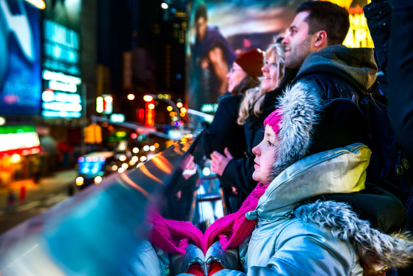 New York City - Tourists looking at Times Square Marquees