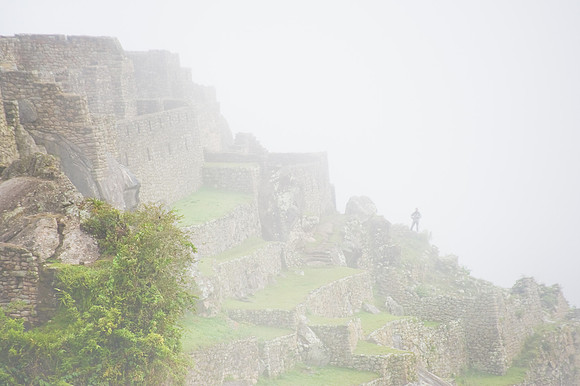Machu Picchu - Man Shrouded in Mist and Clouds
