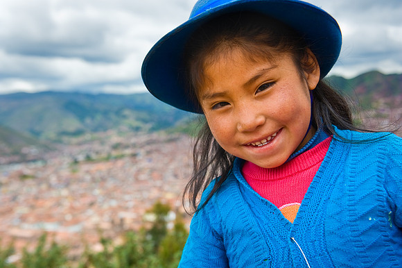 Cusco - Quechua Girl and View of Cusco