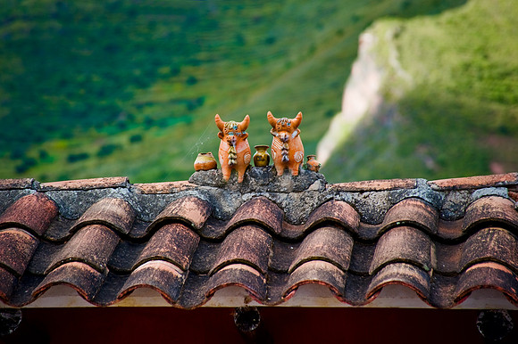 Urubamba - Pair of Ceramic Oxen on Rooftop